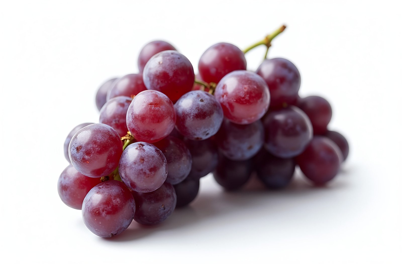 A cluster of purple grapes with a slight shine, giving them a fresh look, isolated on white background