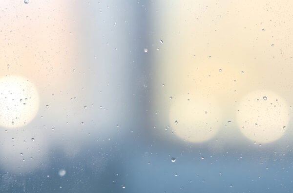 Close-up of frosted glass showing gentle blur and smooth texture, ideal for background or design elements