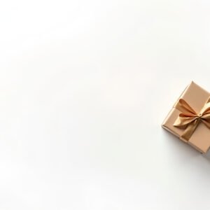 Wrapped gift box with decorative bow and ribbon positioned in corner with large white copy space