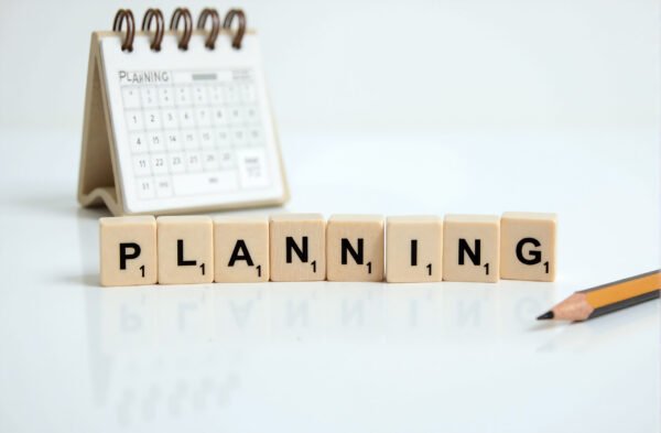 Letter blocks spelling planning with a calendar