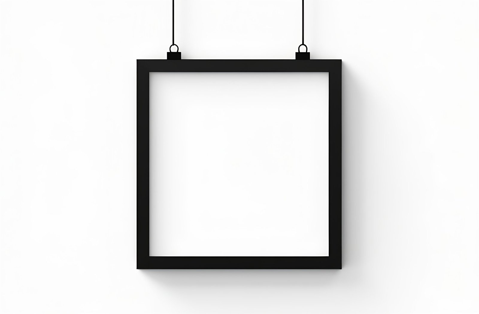 Black rectangular picture frame hanging on white wall showing clean modern home decoration and interior design