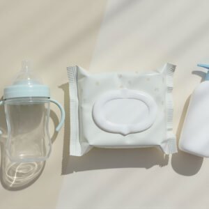 Flat-lay top-view of baby-care products and a sippy cup—free image for parenting, baby product or newborn visuals.