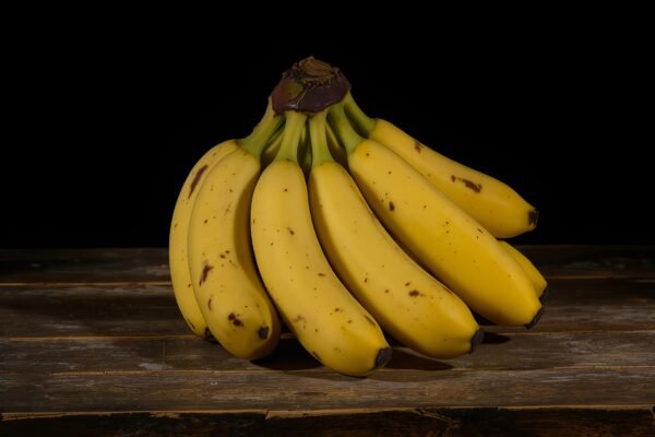 Bunch of ripe bananas on a rustic wooden table