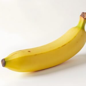 Photorealistic close-up of a fresh yellow banana on a white background