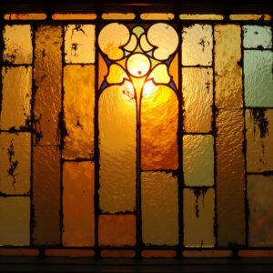 Antique stained textured glass panes with rich colors and ornamental patterns, high-resolution image for design use