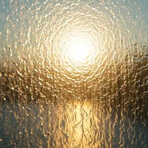 Rippled textured glass with sunlight shining through from behind