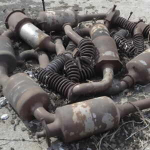 Heap of rusted car springs and assorted scrap metal parts—free image for recycling, industrial waste or texture visuals.