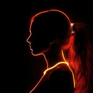 Woman silhouette illuminated by red and yellow neon light—ideal for creative, fashion, or digital art visuals