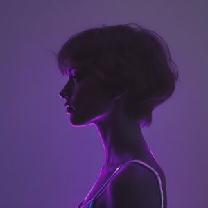Silhouette of a woman with short curly hair, illuminated by violet neon and abstract glowing lights