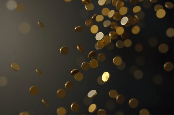 Gold coins falling through the air in slow motion, against a dark gradient background