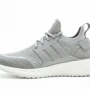 Knit sneaker with sock-like upper and textured foam sole, combining comfort and modern casual style