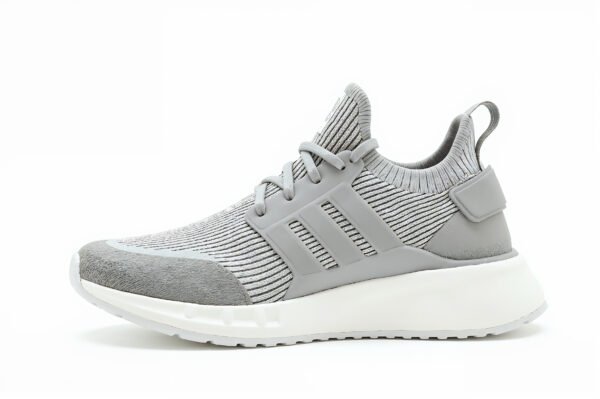 Knit sneaker with sock-like upper and textured foam sole, combining comfort and modern casual style