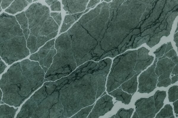 Green marble texture with white and dark green veins—ideal for luxury interiors, architectural renderings, and refined design visuals