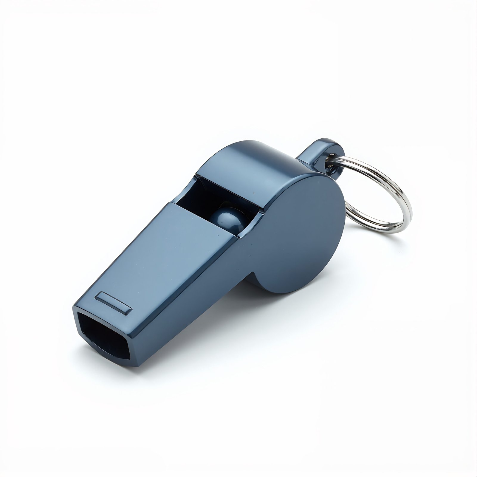 Metal whistle isolated on white background—free image for sports equipment, coaching or icon-style visuals.