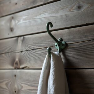 Clothes hook mounted on wooden wall detailed textures soft natural light