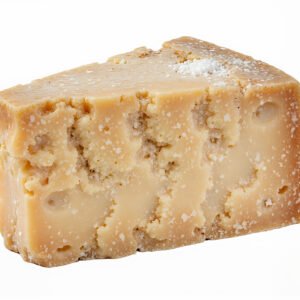 Large wedge of Parmesan cheese with textured rind studio lighting isolated on white background detailed surface texture no branding