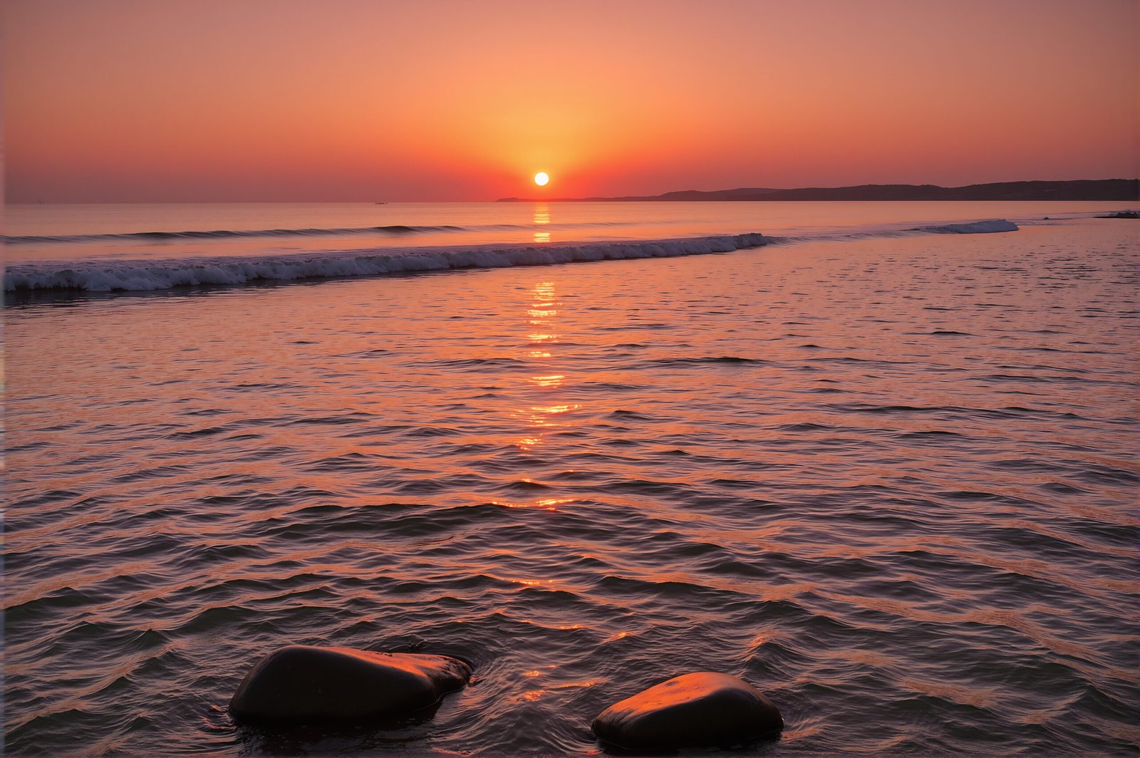 Ocean at sunset with warm colors reflecting on calm waves serene mood