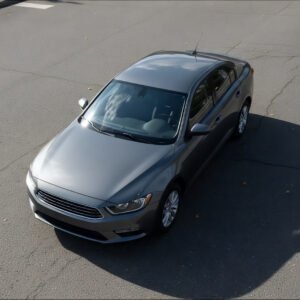 Top down view of generic sedan on asphalt realistic shadows no branding