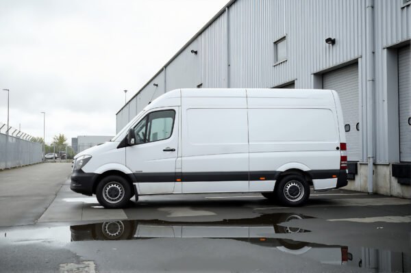 Unbranded delivery van parked beside warehouse white color no logos clean commercial design