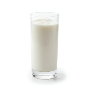 tall clear glass filled with fresh milk soft studio lighting isolated on white background high detail product photo no labels