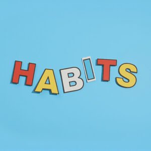 ndividual paper letters spelling HABITS slightly misaligned and playful layout soft shadows minimalist self improvement theme