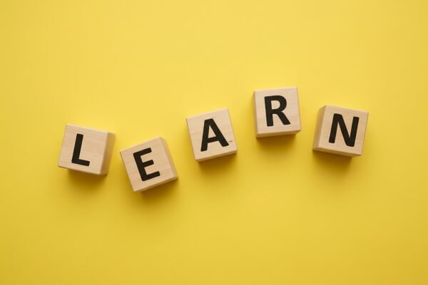 wooden blocks spelling learn l e a r n loosely arranged with different angople no logos no extra objectsspelling must be exact and clearly readable EcFk2MU upscaled