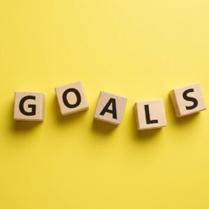 wooden letter cubes spelling goals not perfectly aligned some cubes angledople no logos no extra objectsspelling must be exact and clearly readable cG0pHSQP upscaled